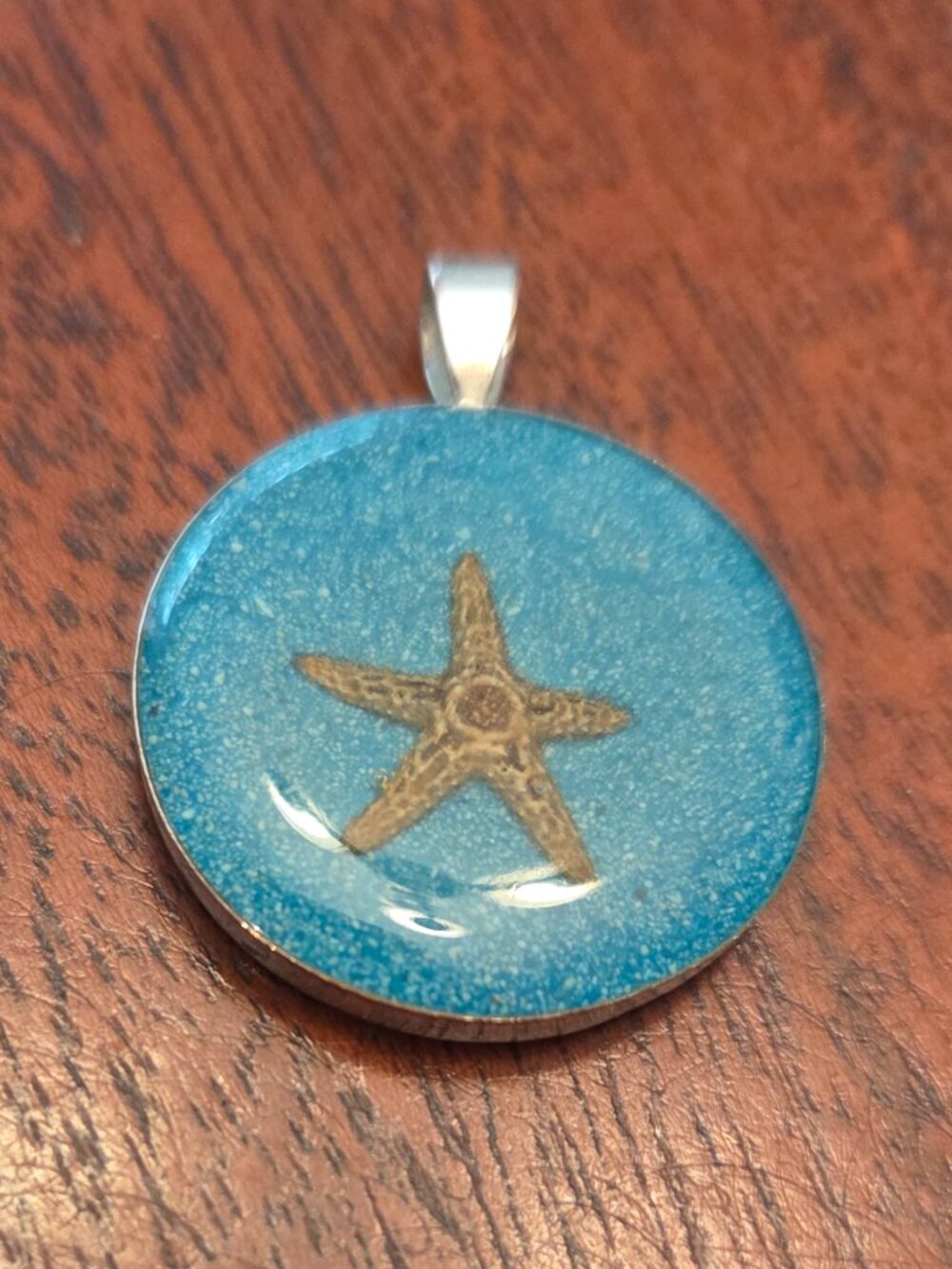 Wellington Williams handmade from Turks & Caicos starfish and sand pendant